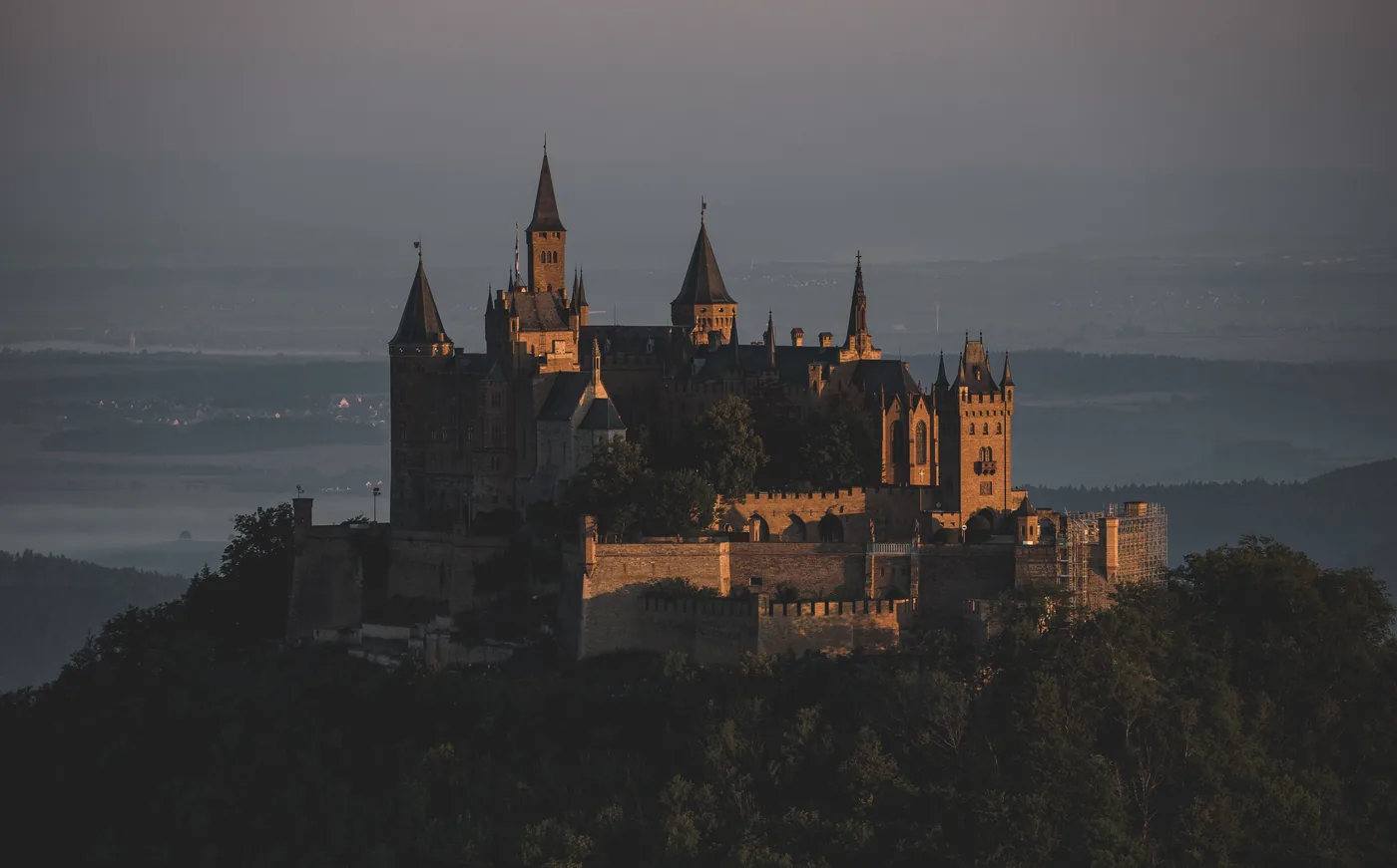 The castle at first light, towers above the mist